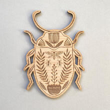 Etched wooden beetle decoration